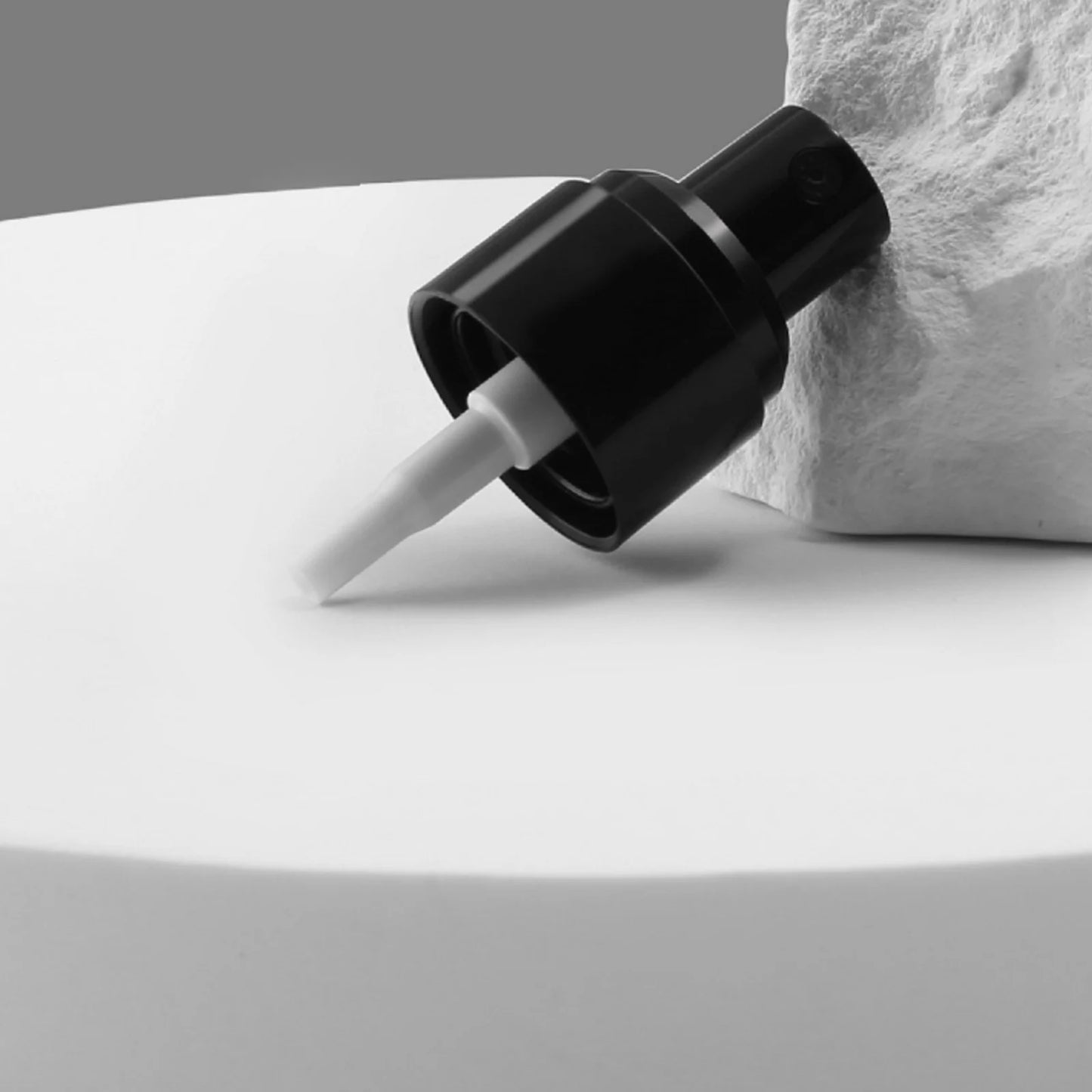coffee bean water spray bottle with a sleek black nozzle for easy dispensing