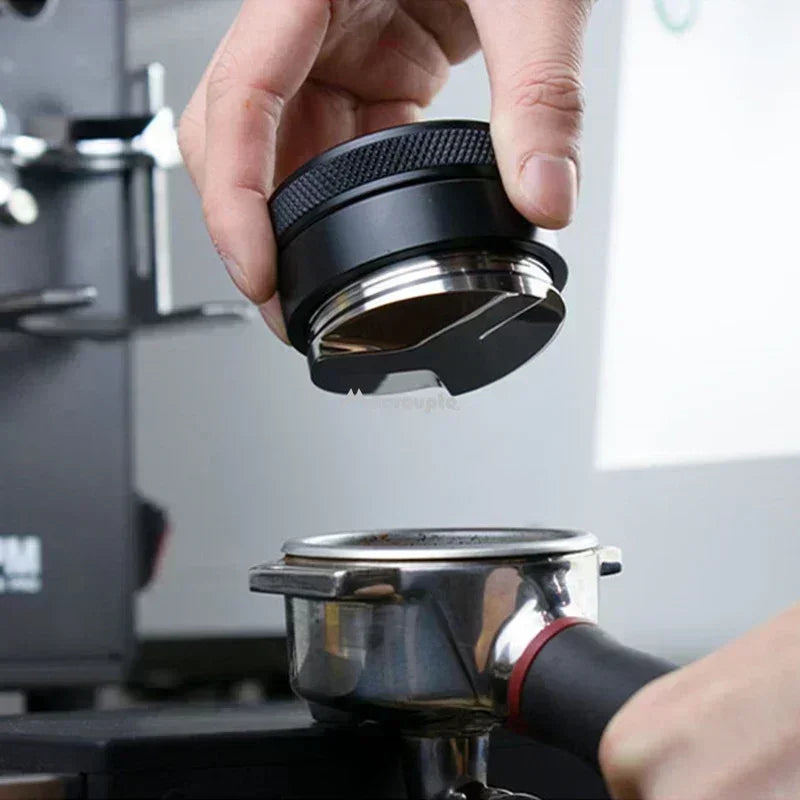 Adjustable espresso distributor being used for perfect grounds preparation in espresso machines