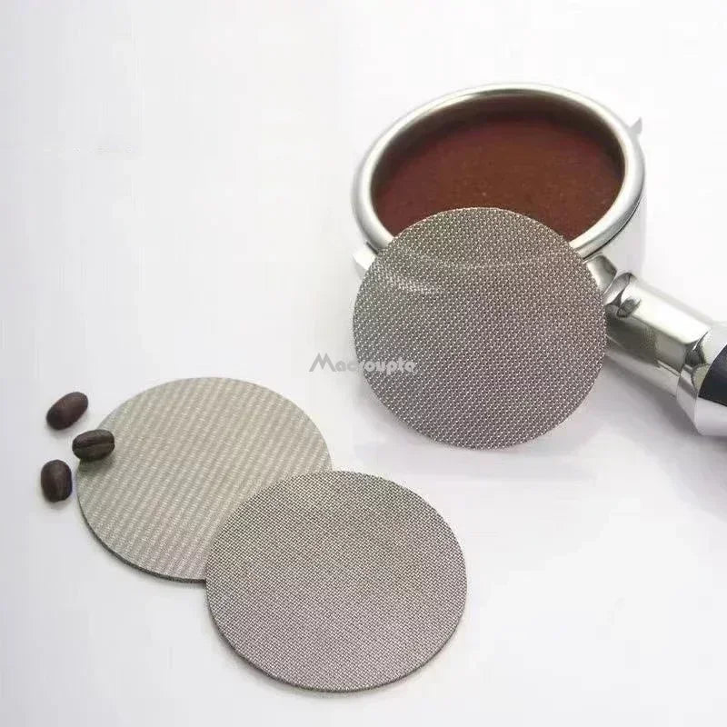 Set of two reusable coffee filter screens with coffee grounds and coffee beans for easy brewing