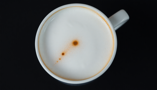 Close-up of a creamy frothing alternative milks coffee with a smooth foam texture