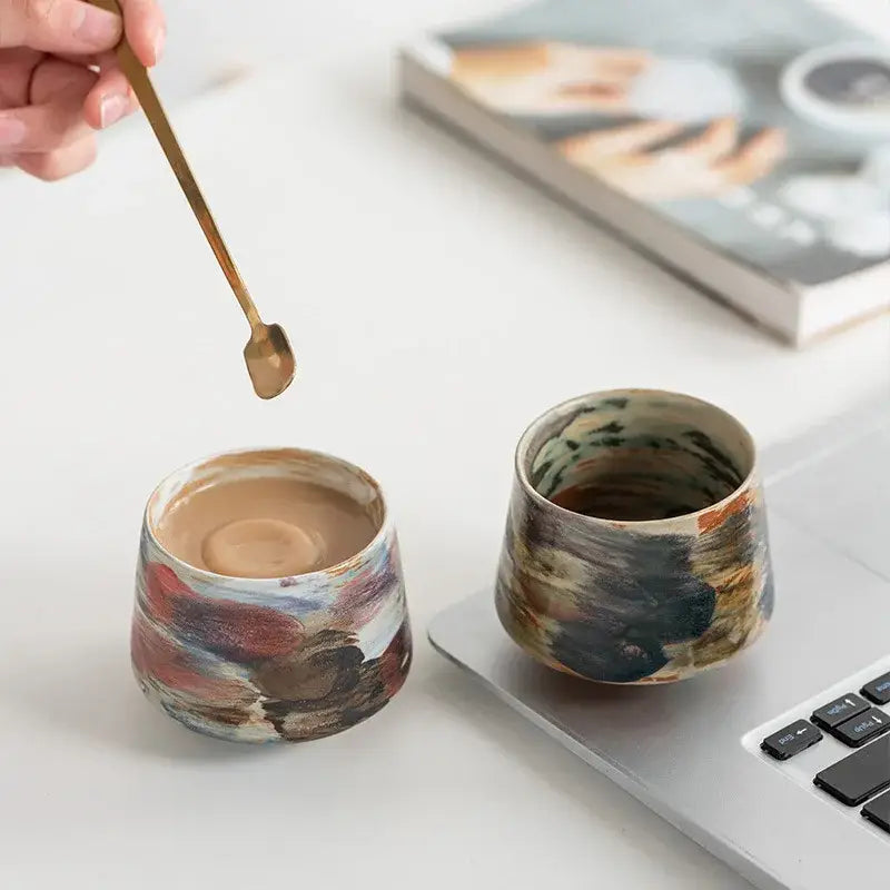 Two hand-crafted espresso cups in colorful designs, perfect for enjoying your favorite espresso drinks