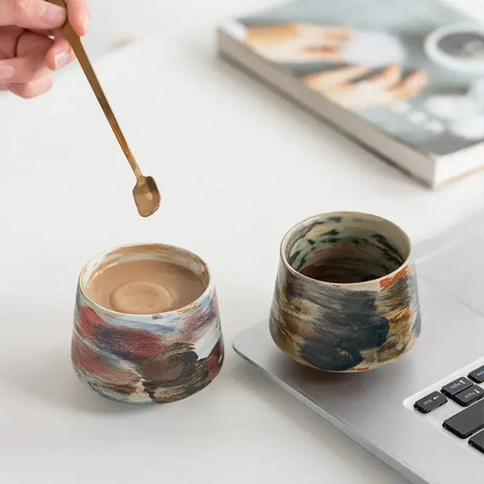 Two hand-crafted espresso cups in colorful designs, perfect for enjoying your favorite espresso drinks