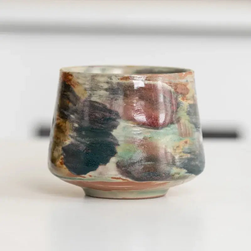 Handcrafted espresso cup featuring a unique marble design, made from ceramic and perfect for coffee lovers.