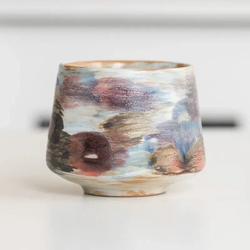 Hand crafted espresso cup featuring a unique colorful design, ideal for coffee enthusiasts