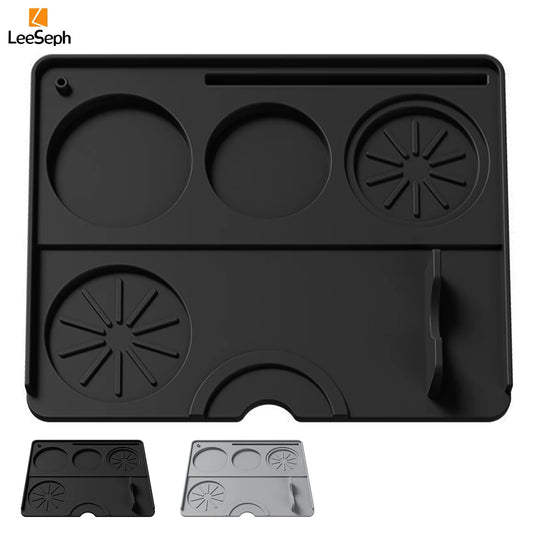 Black espresso tamping mat with compartments for tools and spouts, ideal for baristas and home brewing