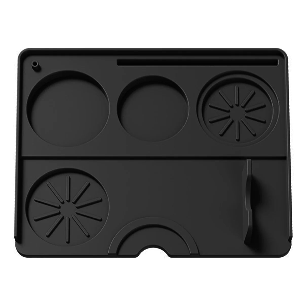 Black espresso tamping mat with multiple indentations for portafilter stability and spill prevention