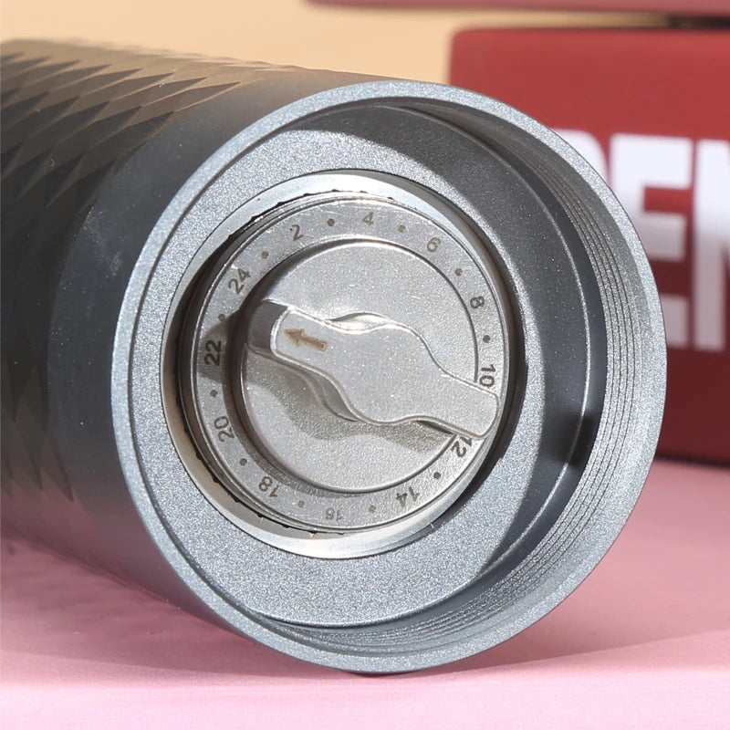 Close-up of adjustable burr coffee grinder settings dial for precise coffee grinding