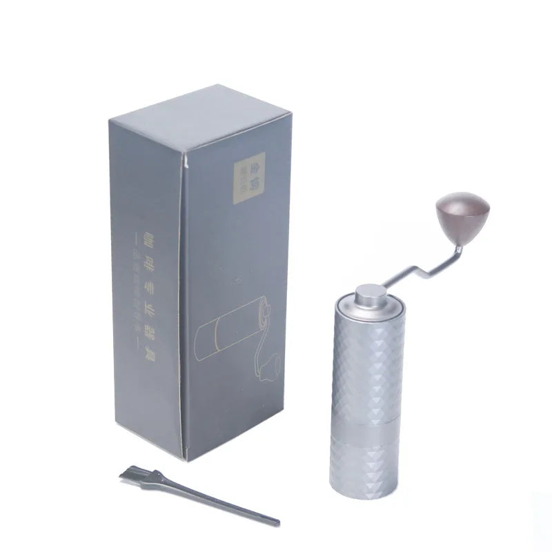 UK Espresso adjustable burr coffee grinder with sleek design and included cleaning tool in packaging