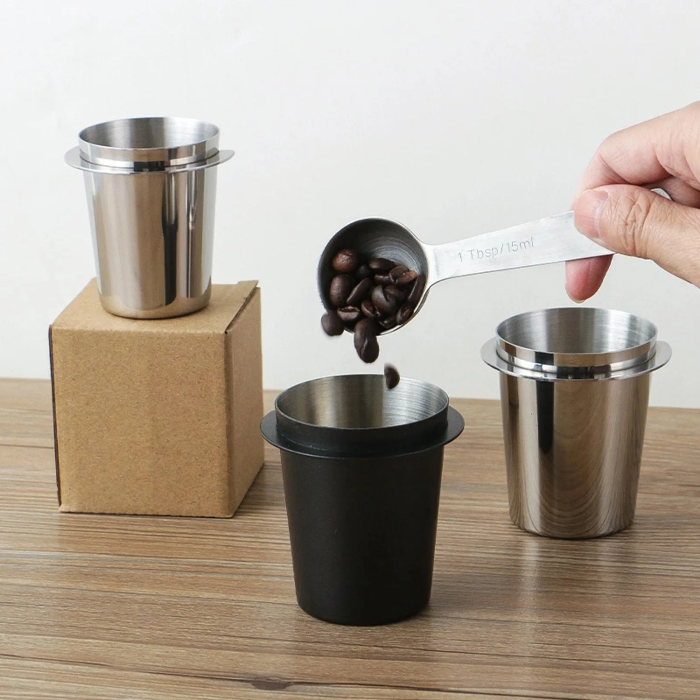 UK Espresso espresso dosing cup in stainless steel and black, perfect for precise coffee measurement