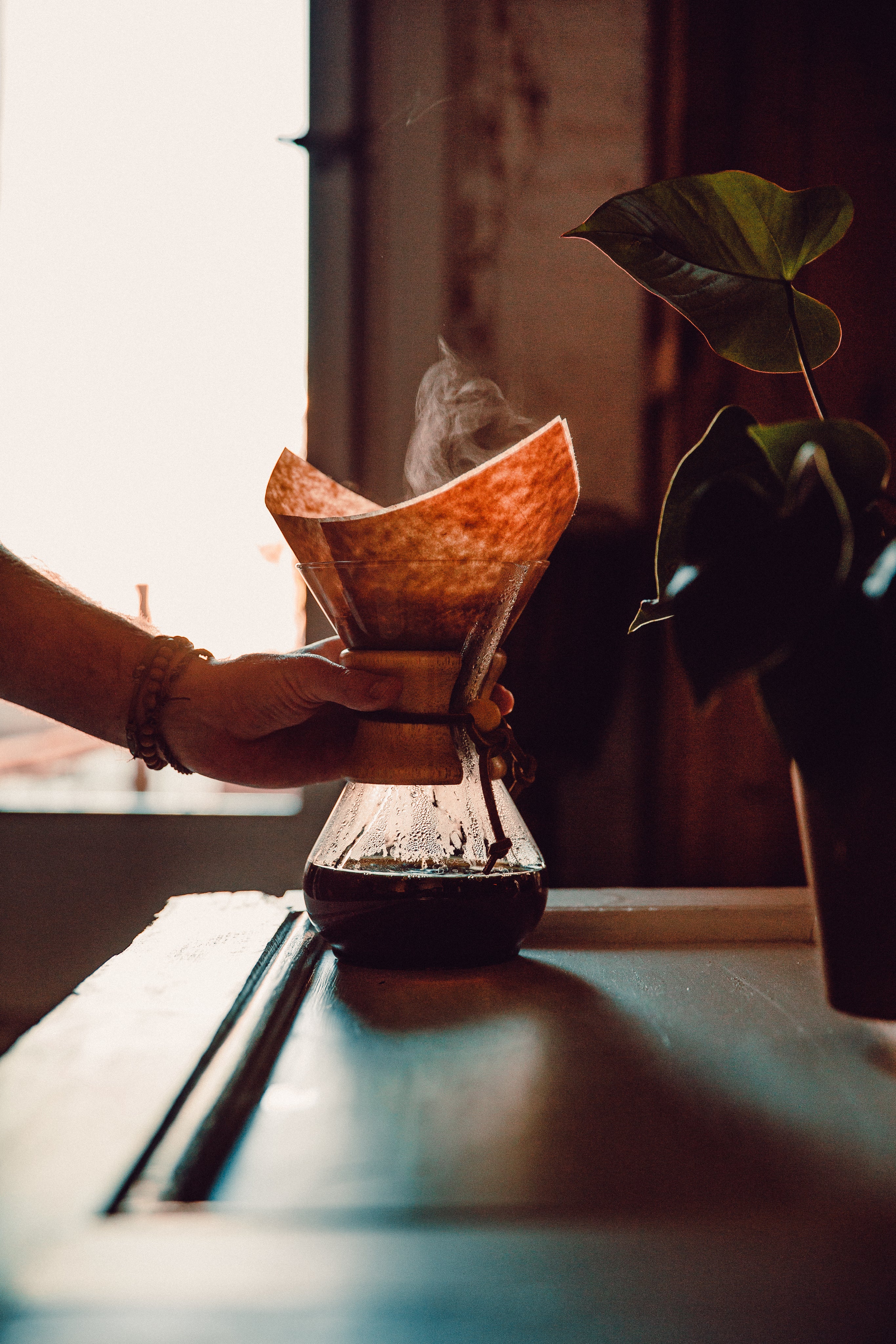hand making coffee with filter at home