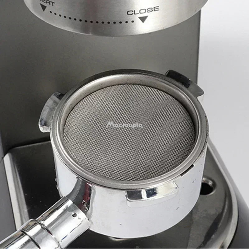 Close-up of a reusable coffee filter screen placed in an espresso machine for eco-friendly brewing